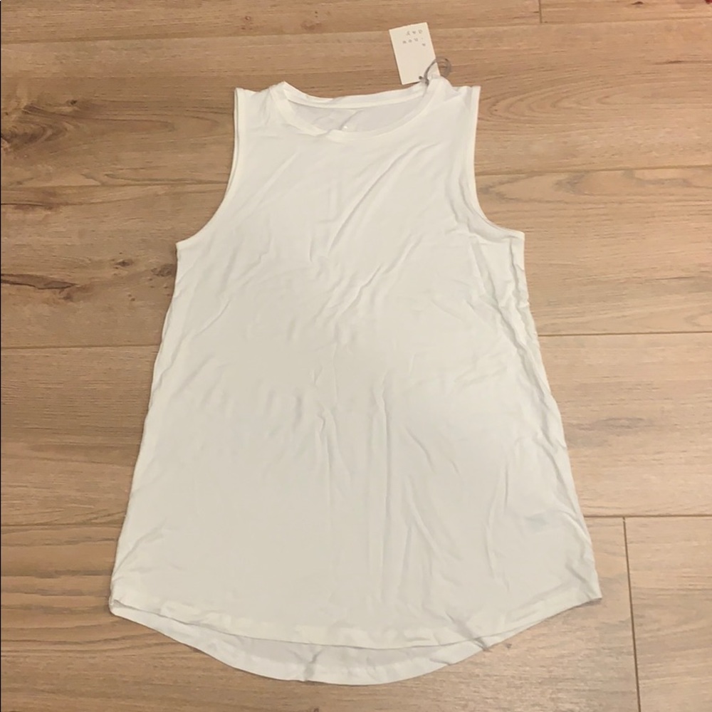 One white, one black, muscle tees, loose fit